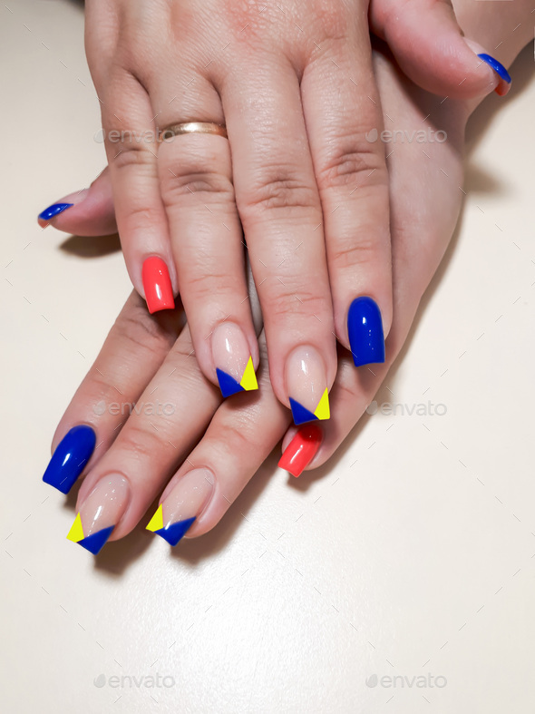 Acrylic nail extension, manicure, nail correction, hands in the foreground. Reflective design